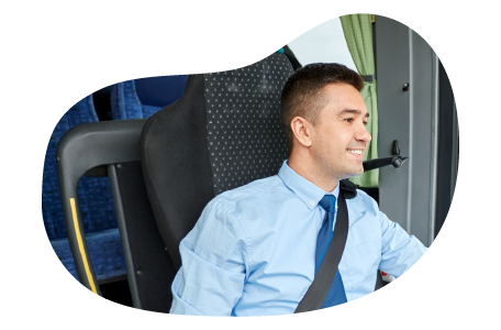 A bus driver greeting passengers.