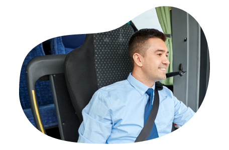 A bus driver greeting passengers. A bus driver greeting passengers.