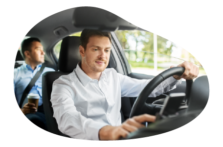 A rideshare driver with a passenger in the back seat.