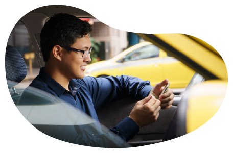 A taxi driver messaging a client. A taxi driver messaging a client.