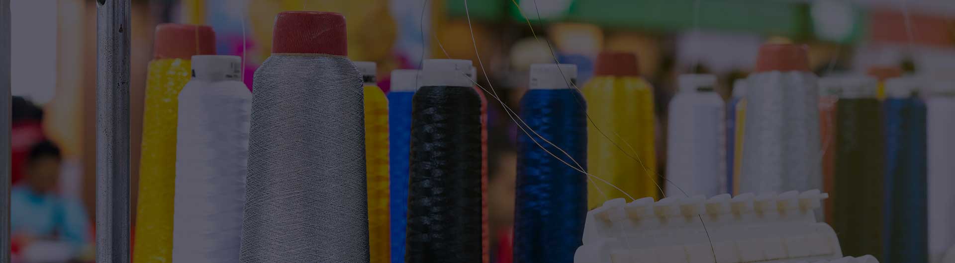 Cotton reel thread set up at modern and automatic high technology sewing machine for textile or clothing apparel making.