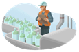 Man in hard hat with clipboard watching bottles on a conveyor belt.