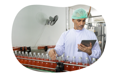 Food and beverage manufacturer inspecting bottles.