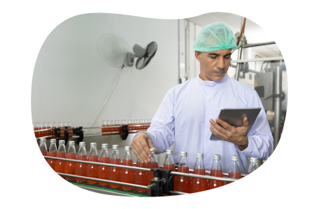 Food and beverage manufacturer inspecting bottles. Food and beverage manufacturer inspecting bottles.