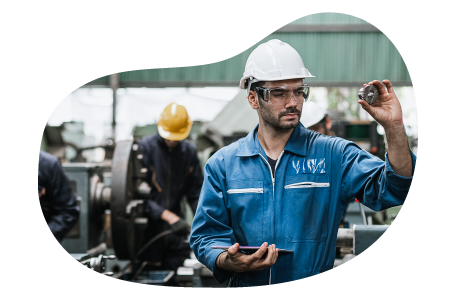 Metal manufacturer inspecting product. Metal manufacturer inspecting product.