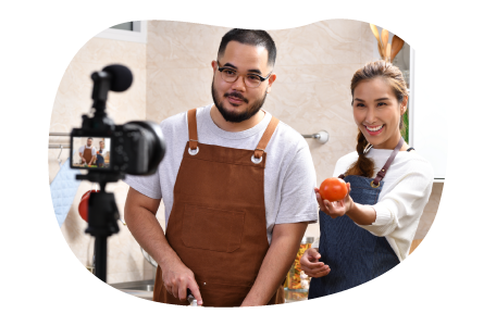 Social influencers recording a video.