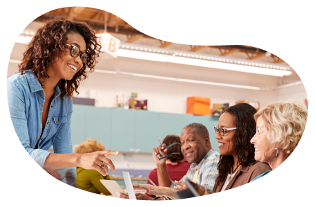 Community center employee working with visitors at an event.
