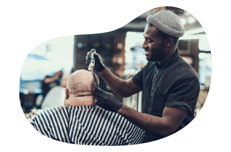 Barber styling a client's hair. Barber styling a client's hair.