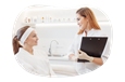 A hair removal specialist meets with a client.