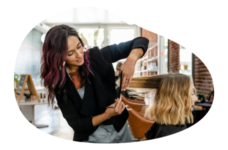 Hairy stylist trimming a client's hair. Hairy stylist trimming a client's hair.