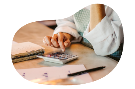 Personal care professional calculating the cost of business insurance.