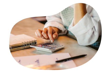 Personal care professional calculating the cost of business insurance. Personal care professional calculating the cost of business insurance.
