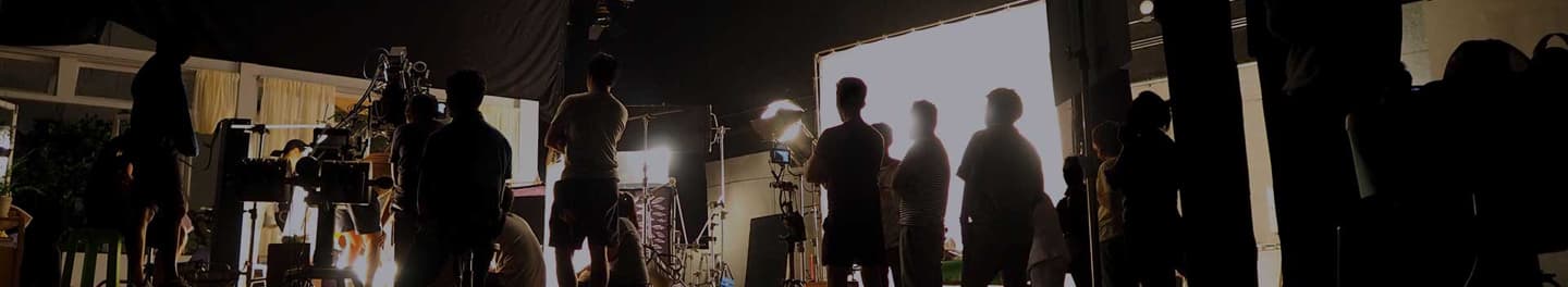 Production studio with a set full of people.