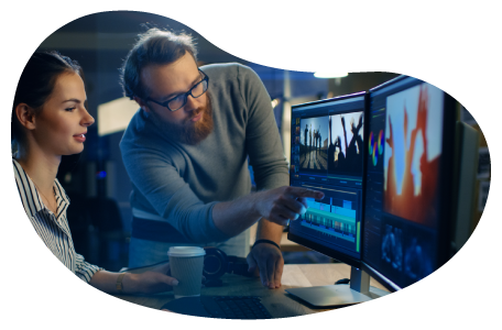 Video production crew reviewing a scene in an editing studio. Video production crew reviewing a scene in an editing studio.