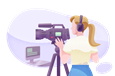 Videographer filming in a studio.