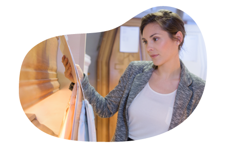 Funeral director examining an empty casket.