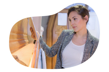 Funeral director examining an empty casket. Funeral director examining an empty casket.