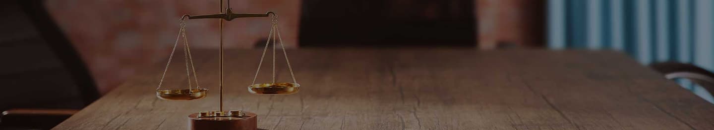 Lawyer's desk with a golden scale.