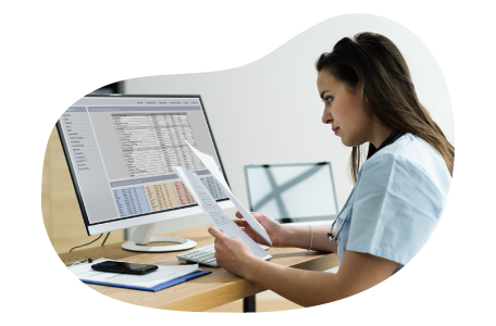 Medical billing professional reviewing invoices.