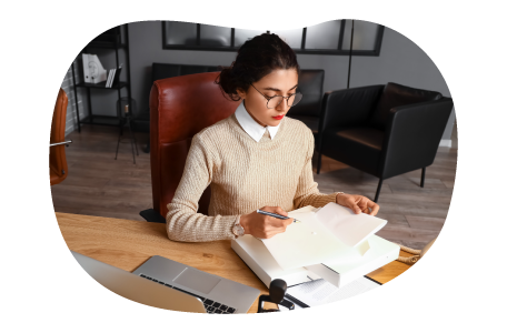 Notary reviewing documentation to be notarized.