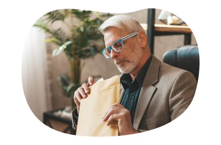 Process server examining court documents in an envelope. Process server examining court documents in an envelope.