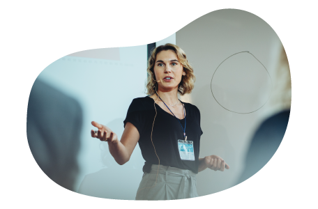 Public speaker giving a lecture in front of a group of people. Public speaker giving a lecture in front of a group of people.