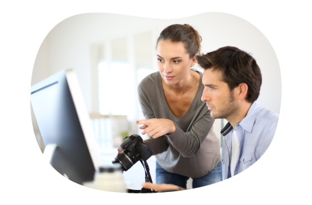 Publisher reviewing an article with an editor.