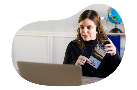 Travel agent assisting a client on a call. Travel agent assisting a client on a call.