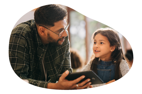 Tutor helping teach a child. Tutor helping teach a child.