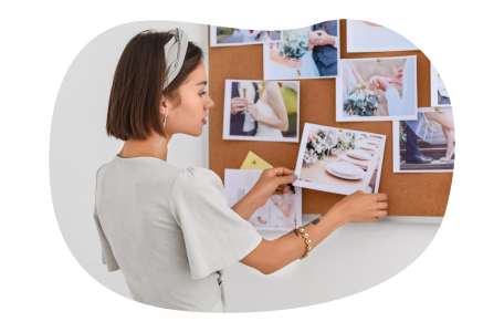 A wedding planner assembles a storyboard for a client's wedding.