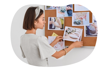 A wedding planner assembles a storyboard for a client's wedding. A wedding planner assembles a storyboard for a client's wedding.