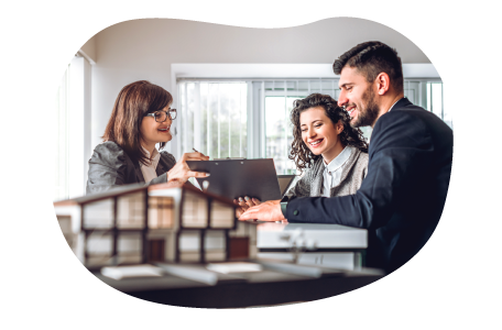 Mortgage broker reviewing housing information at a table with clients.