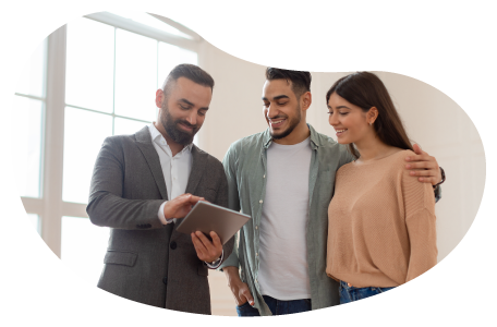 Real estate agent reviewing housing information with two clients. Real estate agent reviewing housing information with two clients.