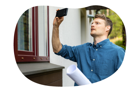 Real estate appraiser taking pictures of a client's home.