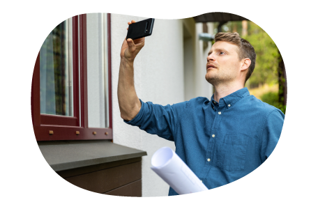Real estate appraiser taking pictures of a client's home. Real estate appraiser taking pictures of a client's home.