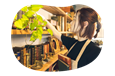 An employee arranging books in an antique shop.