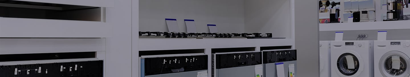 Washing machines and other units on display at an appliance store. Washing machines and other units on display at an appliance store.