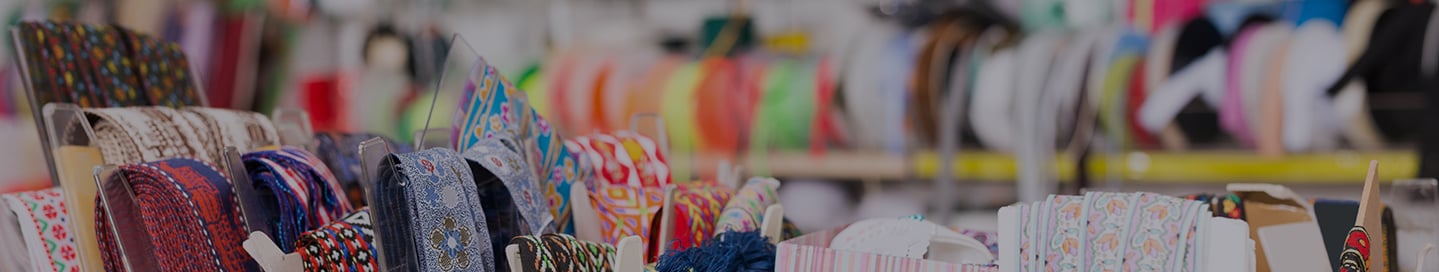 Colorful fabric samples on display at an arts and crafts store. Colorful fabric samples on display at an arts and crafts store.