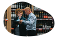 Liquor store salesman showing inventory to a client.