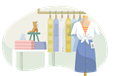 Clothes and boot on display at a clothing store.
