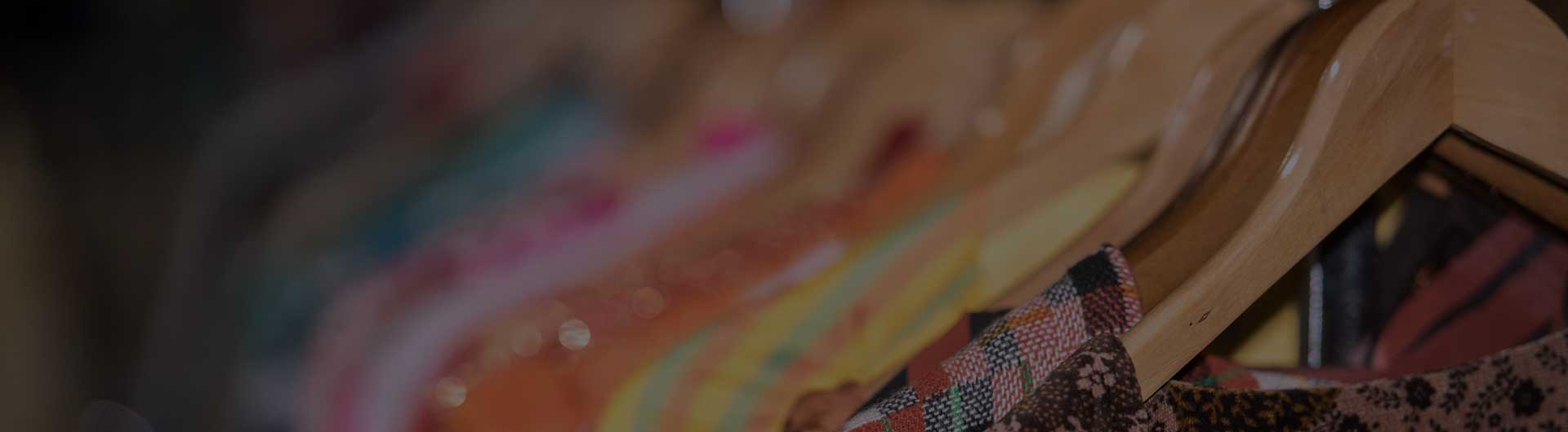 Detail of vintage clothes for sale inside a shop.