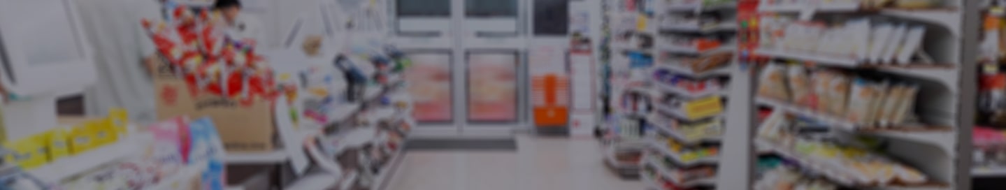 Shelves loaded with snacks and other items at a convenience store.