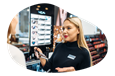 Beauty product salesperson showing accessories on display to a customer.