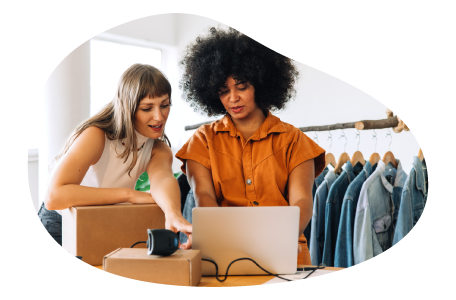 Online retailer employees fulfilling an order on a computer.