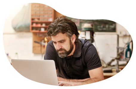 An eBay seller posts a product for sale on their laptop. An eBay seller posts a product for sale on their laptop.