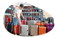 A customer looks over a selection of rolling luggage.