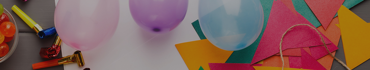 Balloons, party blowers, and other party supplies.