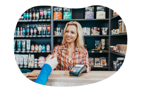 Pet supply store cashier checking out a customer at a counter. Pet supply store cashier checking out a customer at a counter.