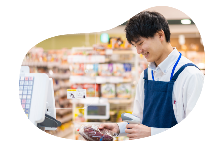 A cashier at a pharmacy rings up an order at a counter. A cashier at a pharmacy rings up an order at a counter.