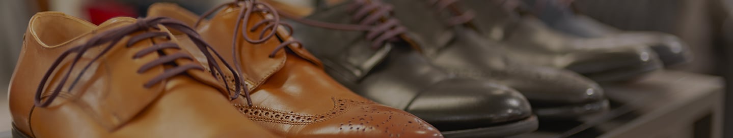 A display of leather shoes in a shoe store. A display of leather shoes in a shoe store.